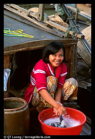 Vietnamese People / Woman doing laundry on live-aboard boat.jpg